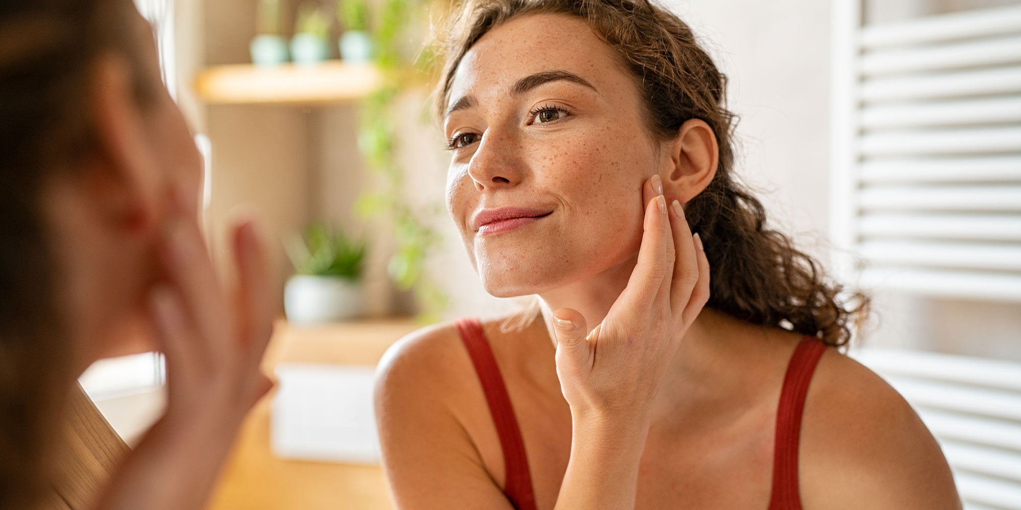 woman looking in the mirror
