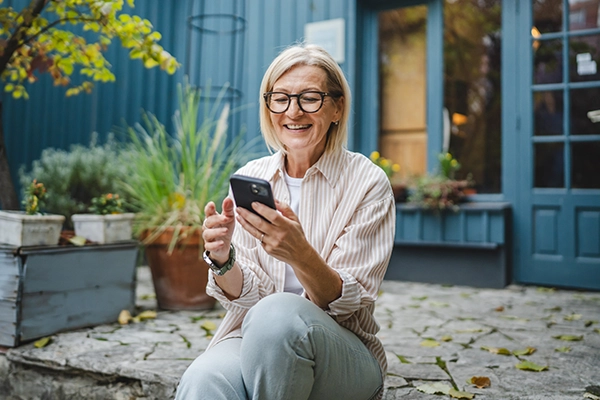 A woman schedules a doctor's appointment on her phone