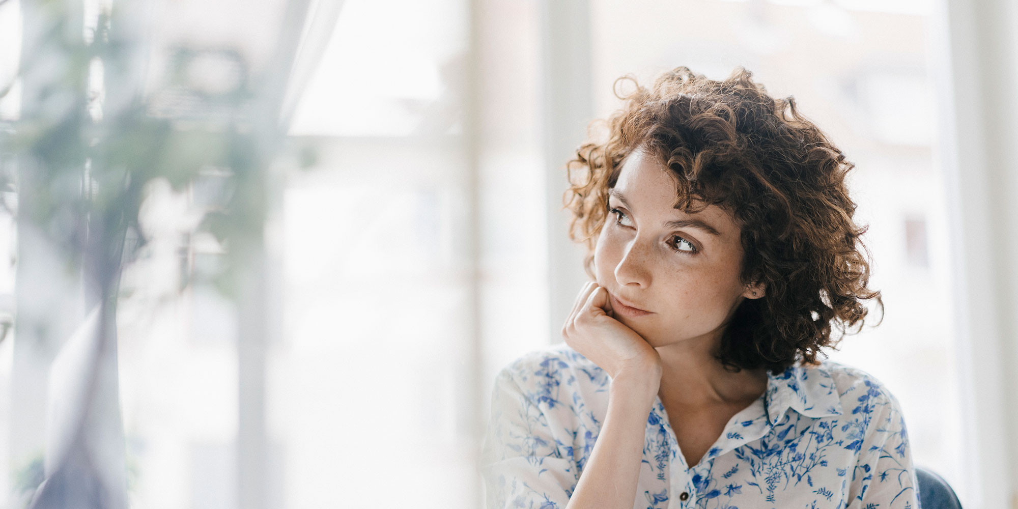 woman gazing out window